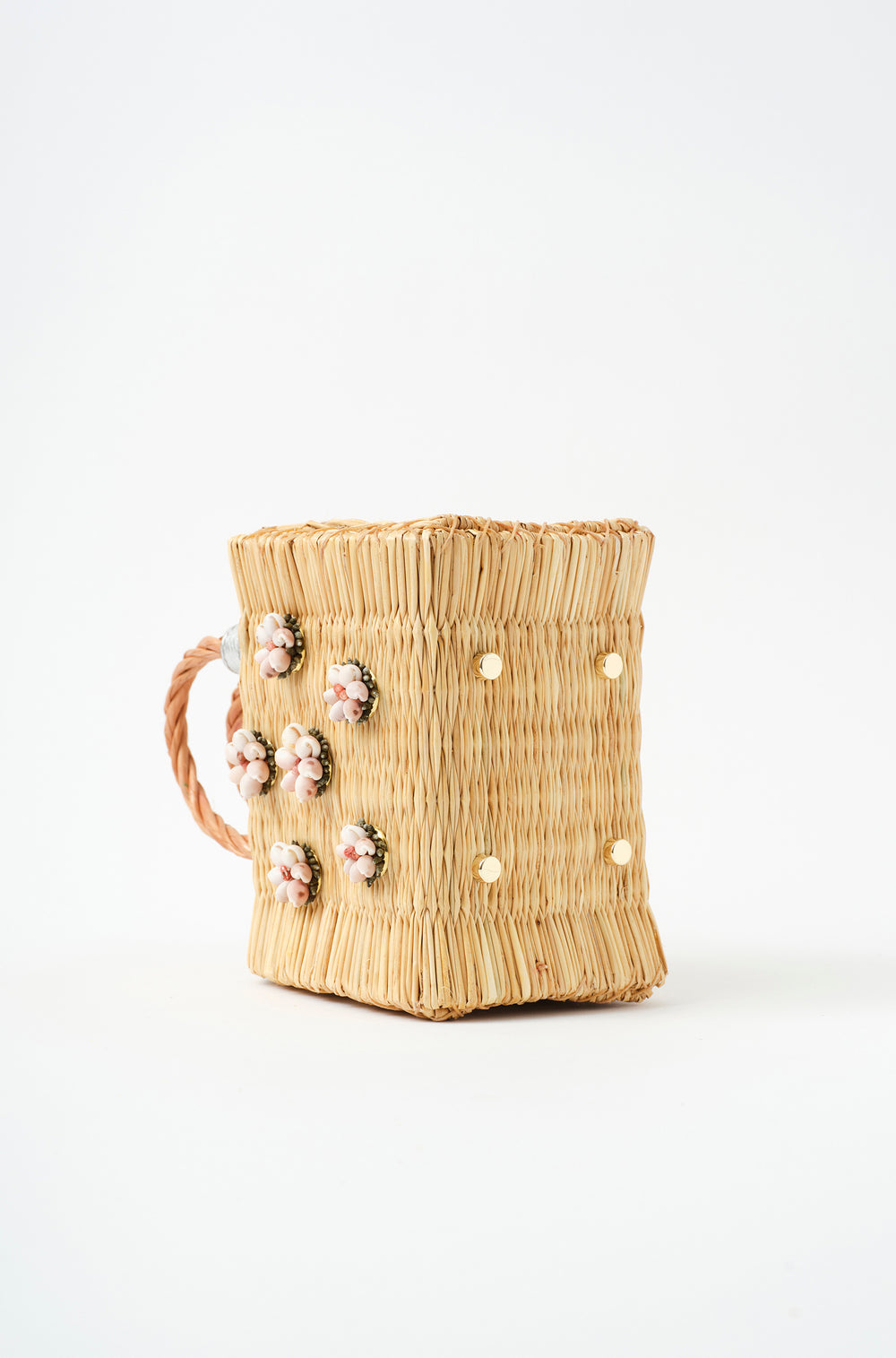 Shella Mini Silver basket bag by Heimat Atlantica, handwoven in Portugal from reed and finished in Spain with an Atlantic shell charm. Golden feets detail. 