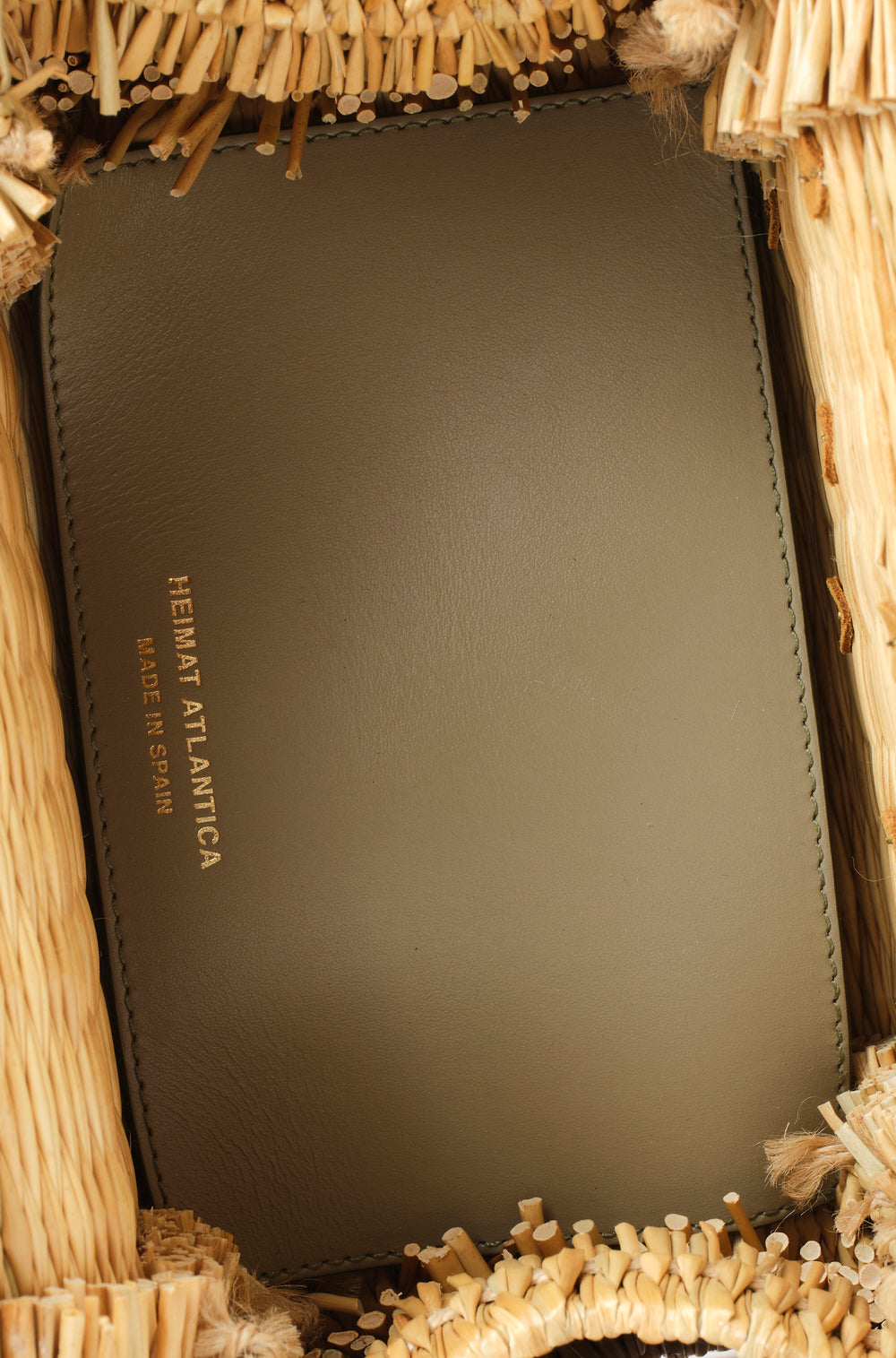 Large Shella basket bag by Heimat Atlantica, woven in Portugal and finished in Spain with Atlantic shell charm and leather details. Interior leather olive detail. 