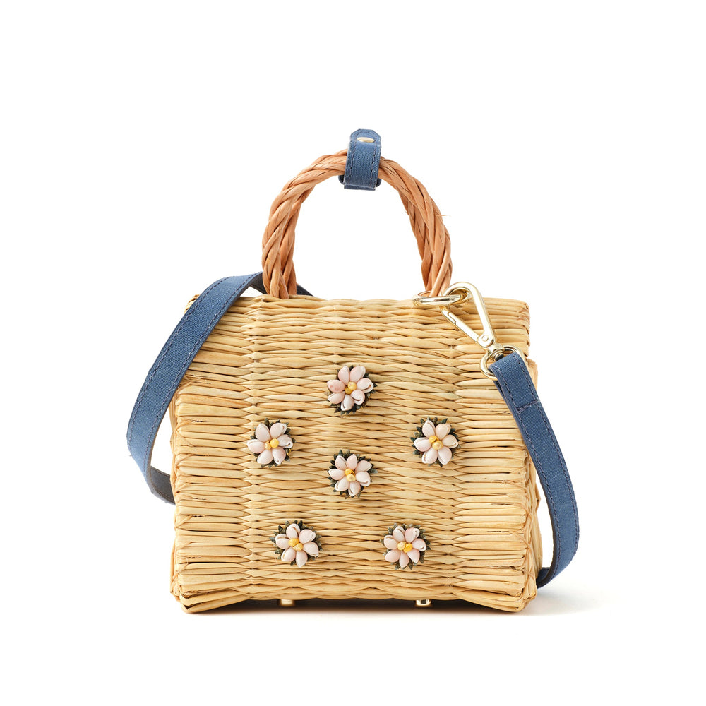 Mini Shella basket bag by Heimat Atlantica, handwoven in Portugal from reed and finished in Spain with an Atlantic shell detail.