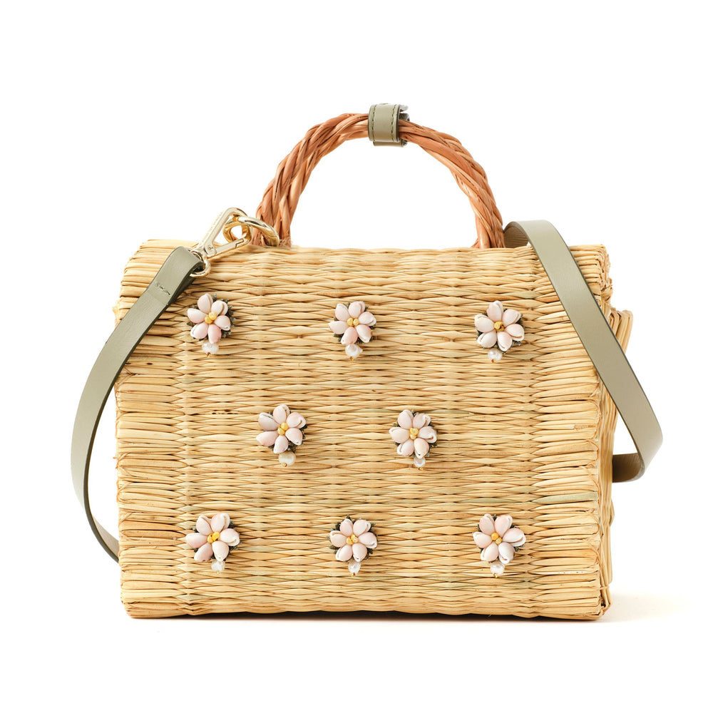 Large Shella basket bag by Heimat Atlantica, woven in Portugal and finished in Spain with Atlantic shell charm and leather details. General view with strap. 