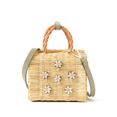 Mini Shella Valenitnie's basket bag by Heimat Atlantica, handwoven in Portugal from reed and finished in Spain with an Atlantic shell detail. General View with strap.