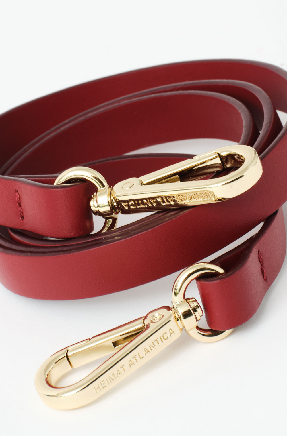 leather strap in terracota with buckle in gold and Heimat Atlantica branding