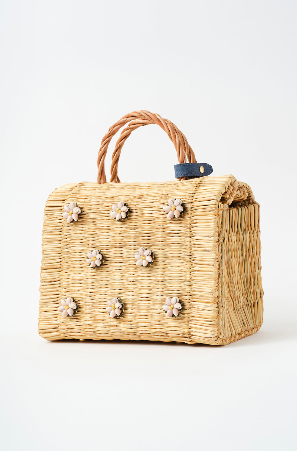 Shella Denim Classic basket bag by Heimat Atlantica, woven in Portugal from reed and finished in Spain with an Atlantic shell charm.