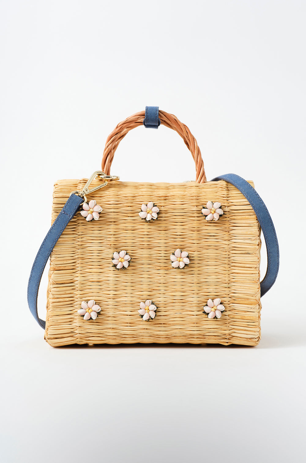 Shella Denim Classic basket bag by Heimat Atlantica, woven in Portugal from reed and finished in Spain with an Atlantic shell charm.