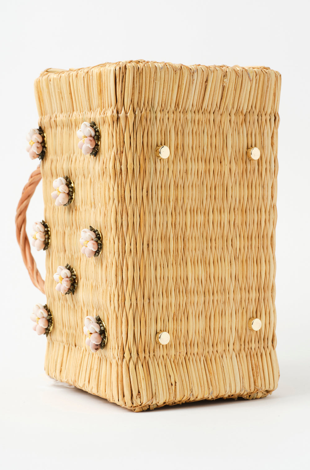 Shella Denim Classic basket bag by Heimat Atlantica, woven in Portugal from reed and finished in Spain with an Atlantic shell charm. Golden feet view
