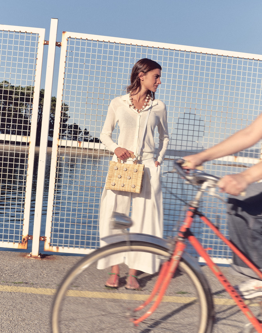 Shella basket bag by Heimat Atlantica photographed on the Atlantic coast between Spain and Portugal, celebrating shell craft, handmade tradition, and contemporary design.
