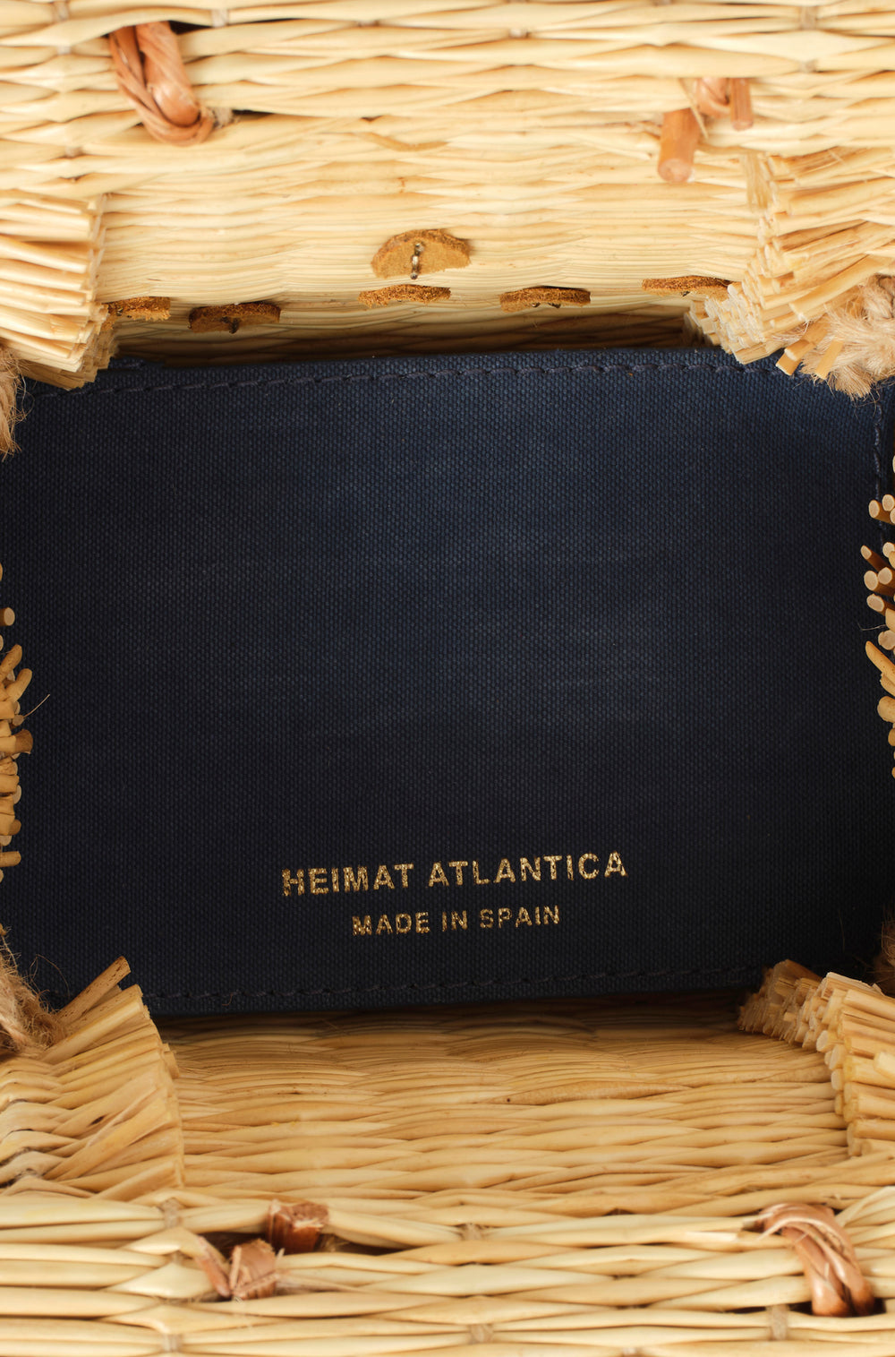 Mini Shella basket bag by Heimat Atlantica, handwoven in Portugal from reed and finished in Spain with an Atlantic shell detail. Leather inside details. 