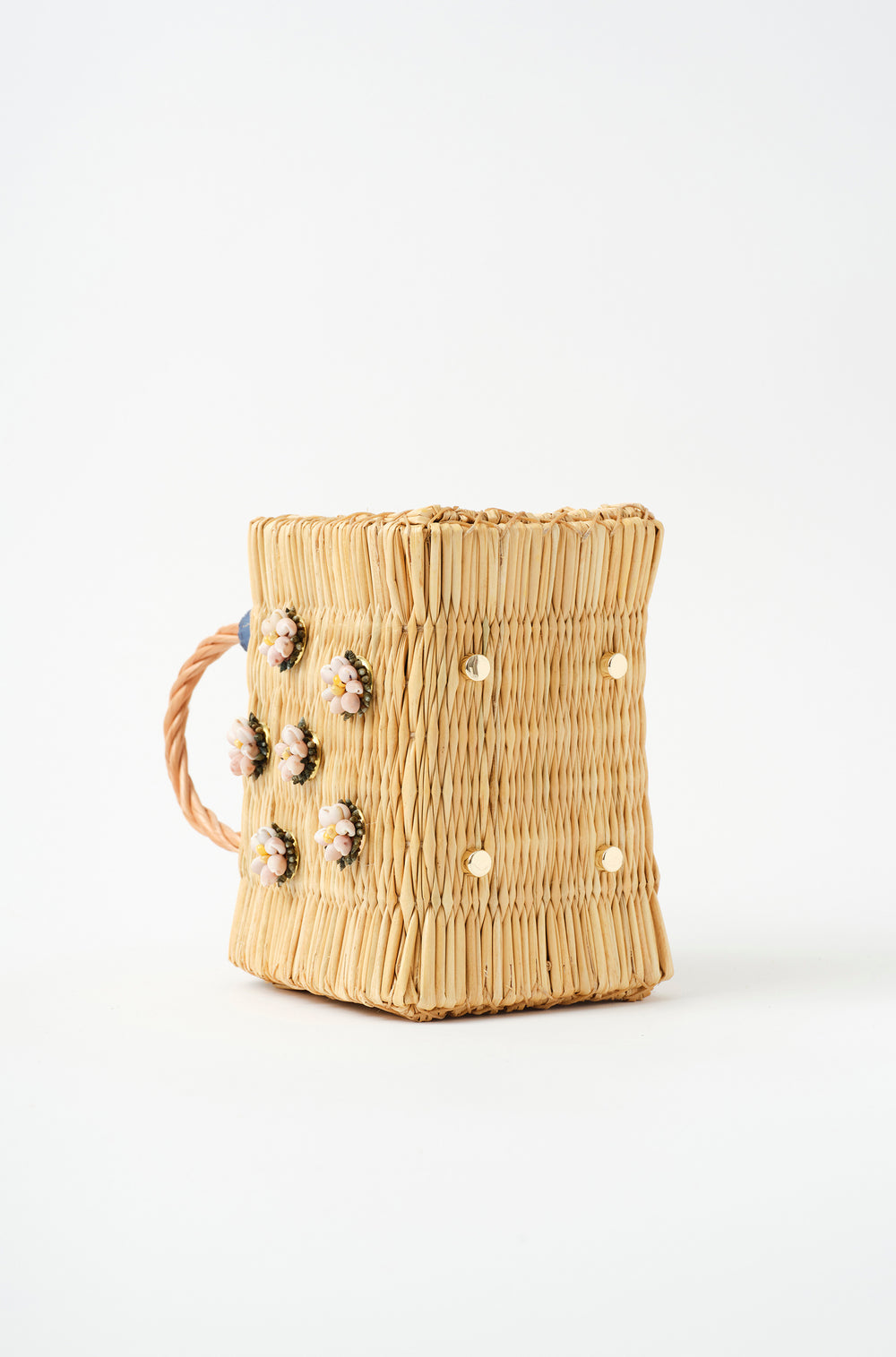 Mini Shella basket bag by Heimat Atlantica, handwoven in Portugal from reed and finished in Spain with an Atlantic shell detail. Golden feet details. 