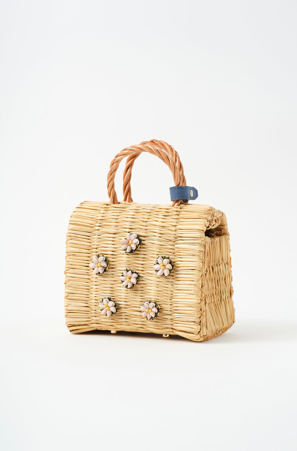 Mini Shella basket bag by Heimat Atlantica, handwoven in Portugal from reed and finished in Spain with an Atlantic shell detail.