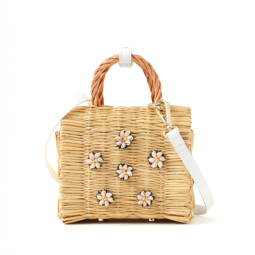 Beige wicker handbag with ice white leather details, a braided handle, adjustable ice blue leather strap, and floral embellishments on the front in yellow Atlantic Shell