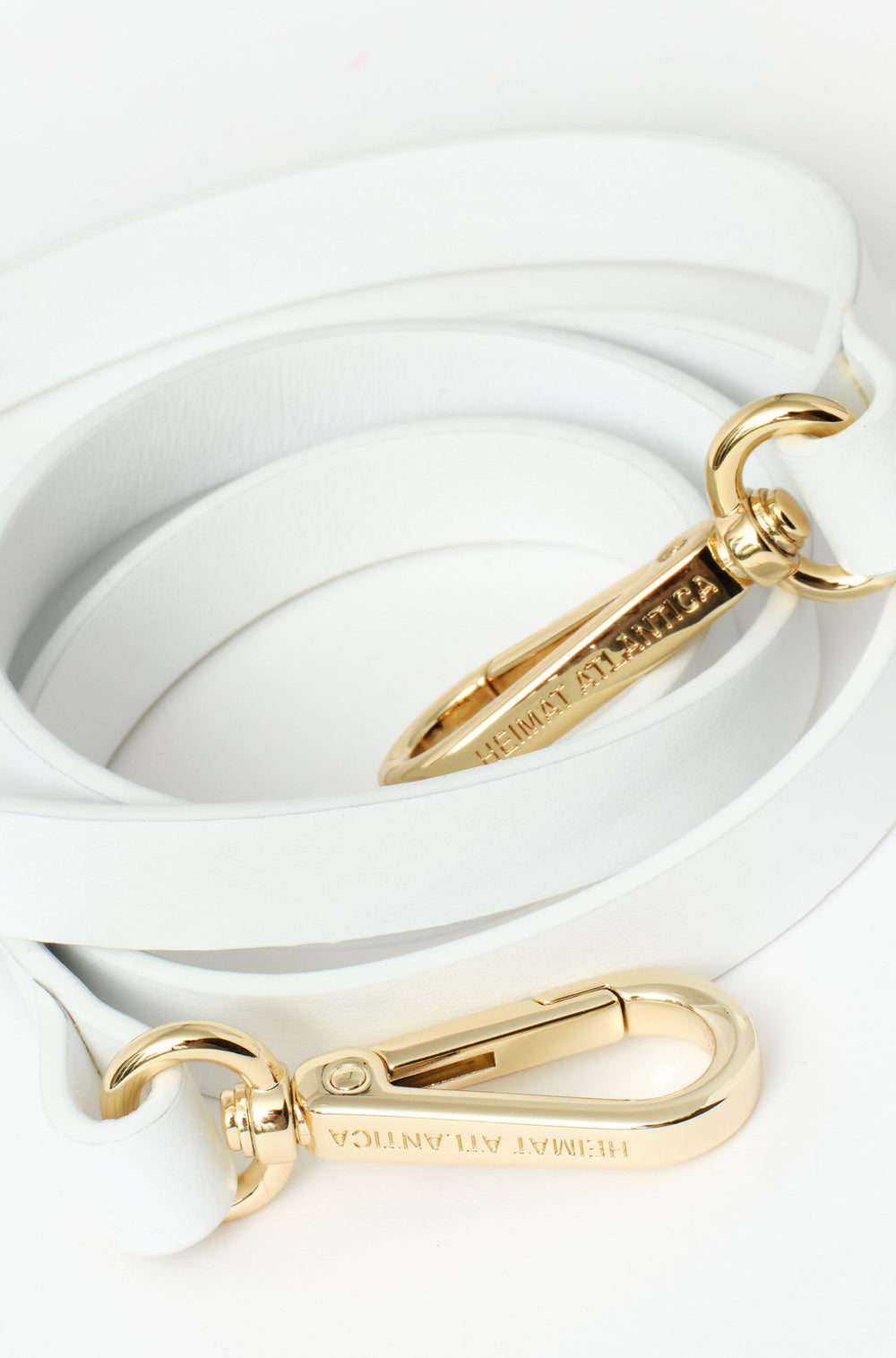 Leather white strap thing with buckle in gold with branding